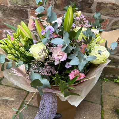 Ashleigh - A budding delight, complimented by greenery and presented in a gift box/bag. Beautiful flower bouquet hand delivered by the local florist.