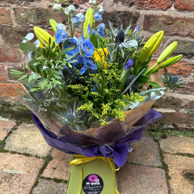 Sunrise - Energise their day with a stunning surprise. A warm collection of seasonal flowers artistically arranged by an artistic florist.
